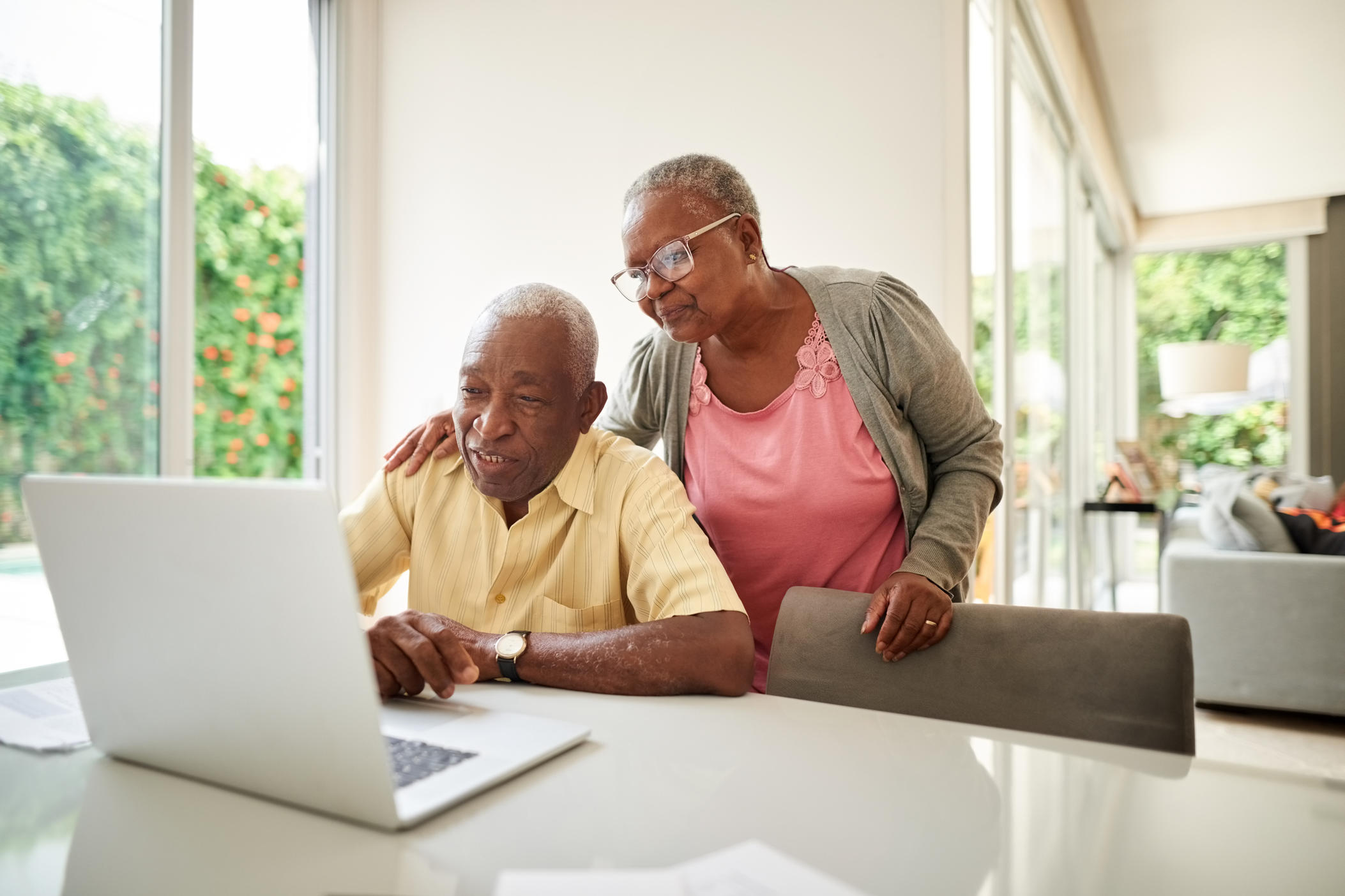 older african american couple looking at computer