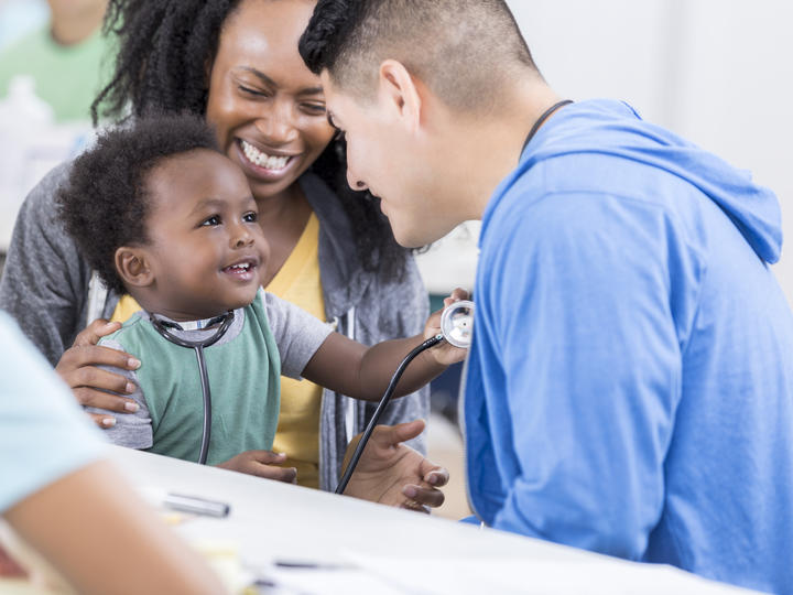mom and baby with a nurse