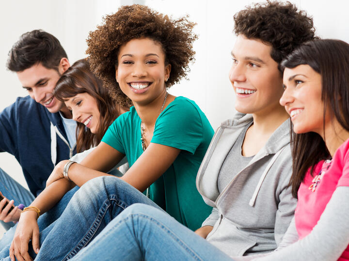 Young adults sitting together in a group