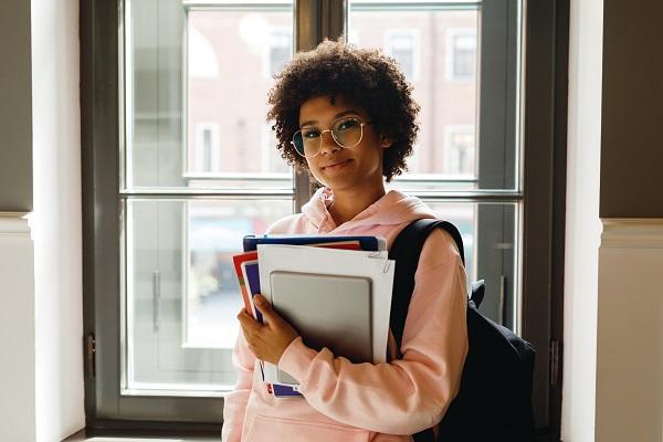 College student holding books