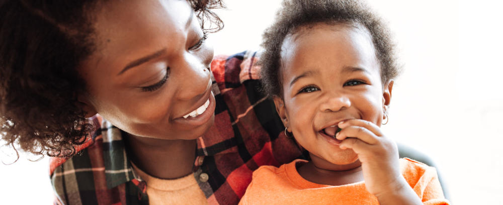 mom and baby eating smiling