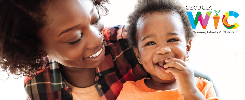 wiclogo mom and baby smiling