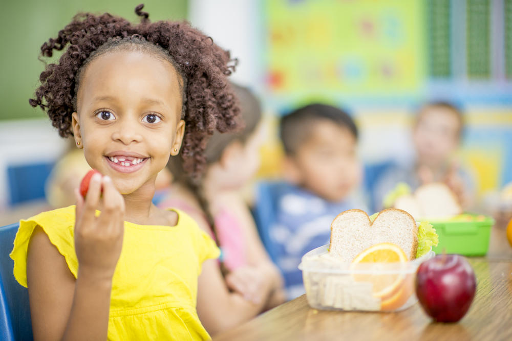 Girl Eating Healthy Snack in School