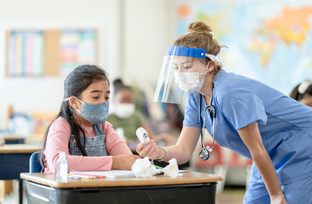 school nurse with a student