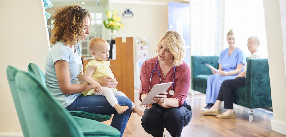 doctor, mom and baby