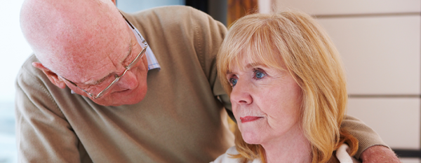 elderly man looking at an elderly woman