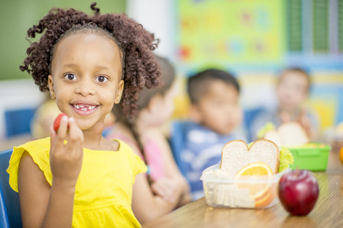 Girl Eating Healthy Snack in School