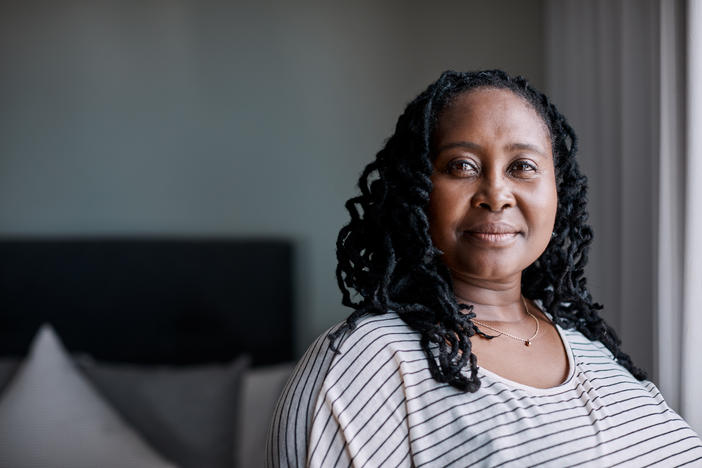 older black woman by a window