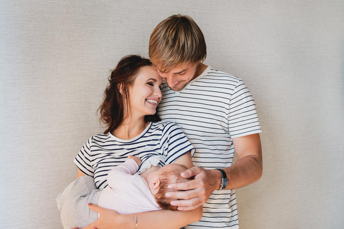 white male and female couple with a baby