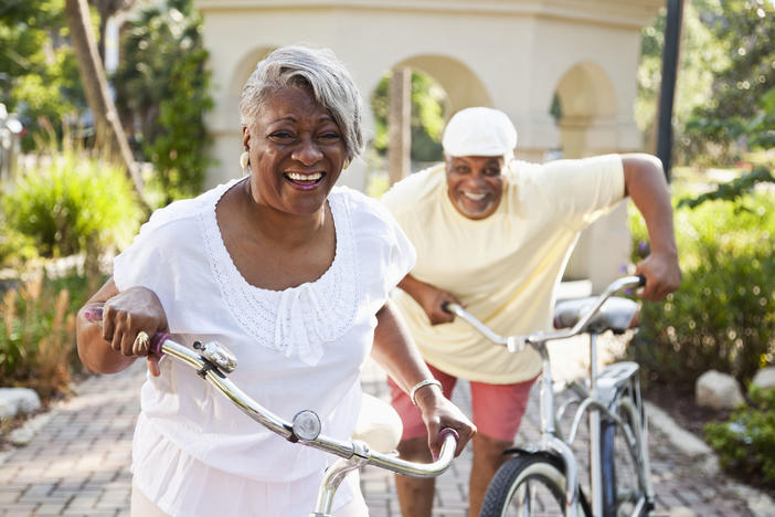 older couple riding bicycles