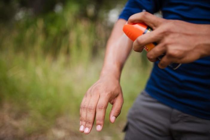 Spraying mosquito repellant