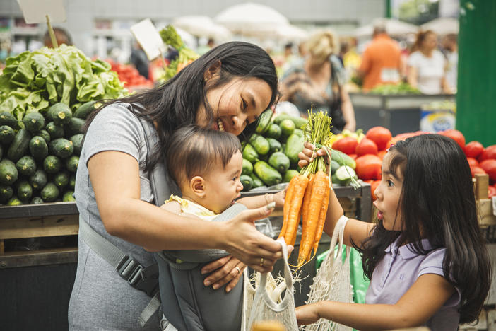 family buying carrots