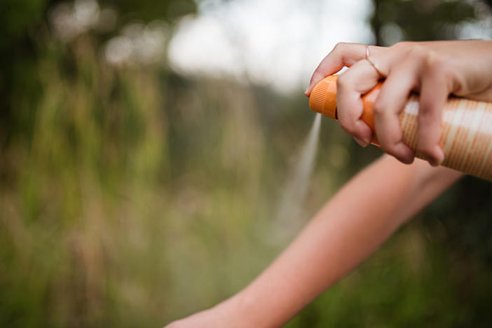 Spraying tick repellent