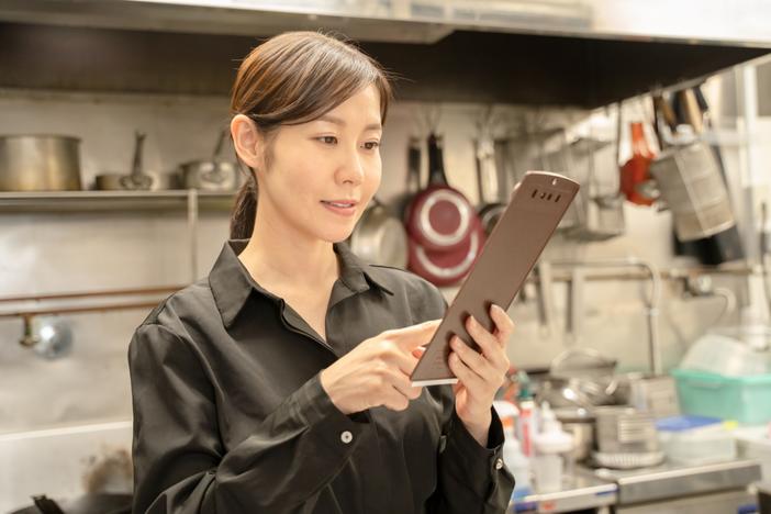 woman holding clipboard