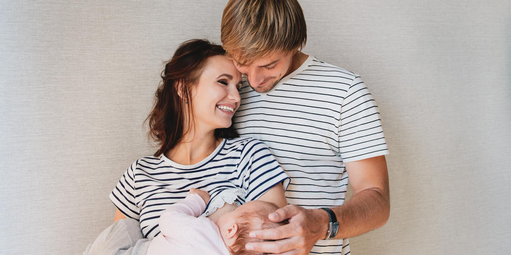 white male and female couple with a baby