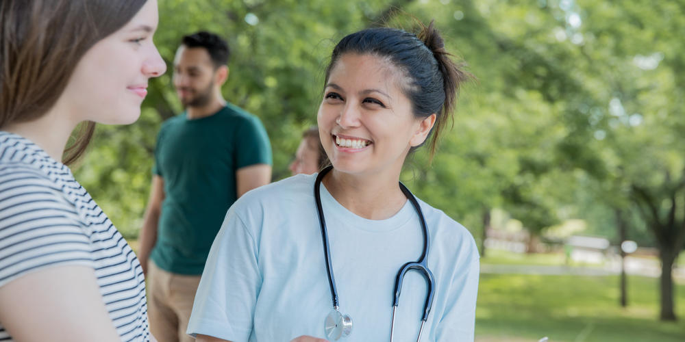 medical resident talking with a patient